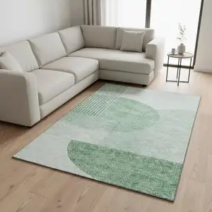 Photo of Green And Ivory Geometric Washable Area Rug With UV Protection