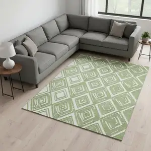 Photo of Green And Ivory Geometric Washable Area Rug With UV Protection