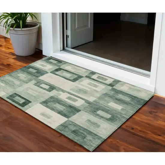 Green And Ivory Geometric Washable Indoor Outdoor Area Rug Photo 1