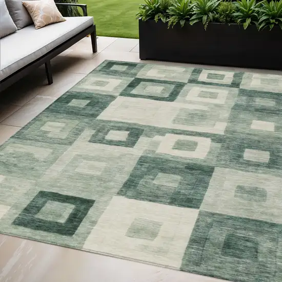 Green And Ivory Geometric Washable Indoor Outdoor Area Rug Photo 1