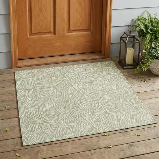Green And Ivory Geometric Washable Indoor Outdoor Area Rug Photo 1
