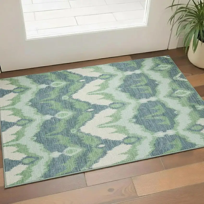 Green And Ivory Ikat Washable Area Rug With UV Protection Photo 1