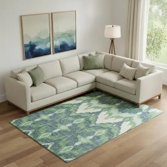 Green And Ivory Ikat Washable Area Rug With UV Protection Photo 1
