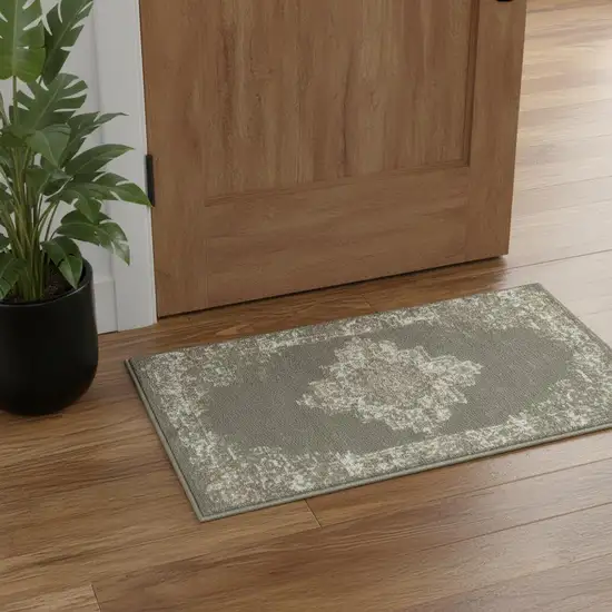 Green And Ivory Medallion Distressed Area Rug Photo 1