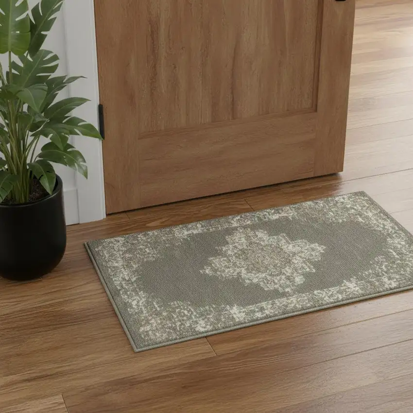 Green And Ivory Medallion Distressed Area Rug Photo 1