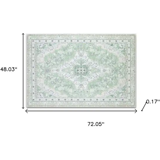 Green And Ivory Oriental Distressed Washable Area Rug Photo 9