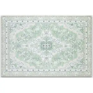 Photo of Green And Ivory Oriental Distressed Washable Area Rug