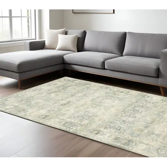 Green And Ivory Oriental Distressed Area Rug Photo 1