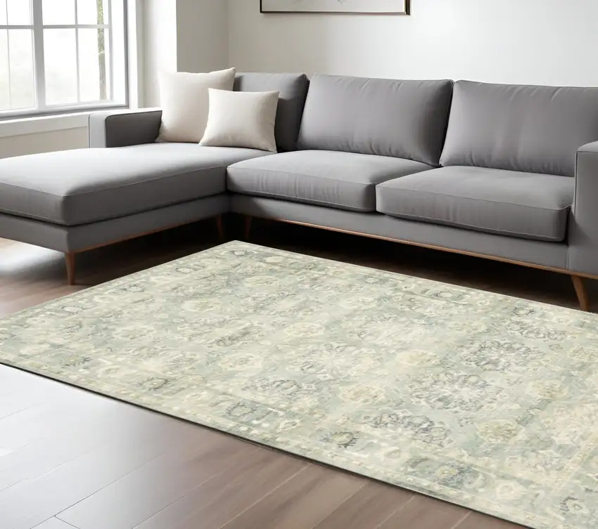 Green And Ivory Oriental Distressed Area Rug Photo 1