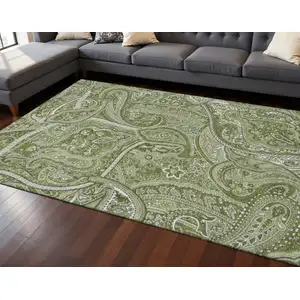 Photo of Green And Ivory Paisley Washable Area Rug With UV Protection