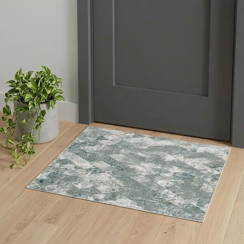 Green And Ivory Patchwork Distressed Stain Resistant Area Rug Photo 1