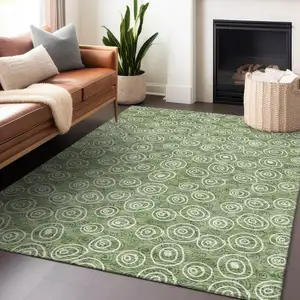 Photo of Green And Ivory Polka Dot Washable Area Rug With UV Protection