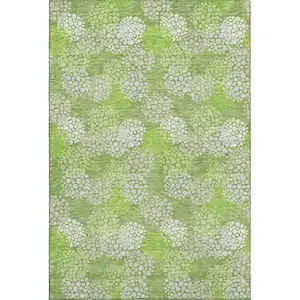 Photo of Green And Ivory Polka Dot Washable Area Rug With UV Protection