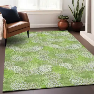 Photo of Green And Ivory Polka Dot Washable Area Rug With UV Protection