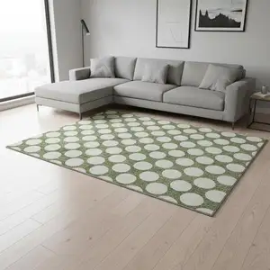 Photo of Green And Ivory Polka Dot Washable Area Rug With UV Protection