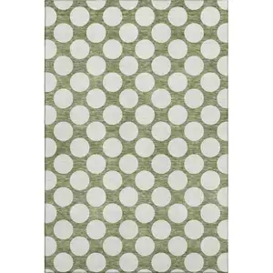 Photo of Green And Ivory Polka Dot Washable Area Rug With UV Protection