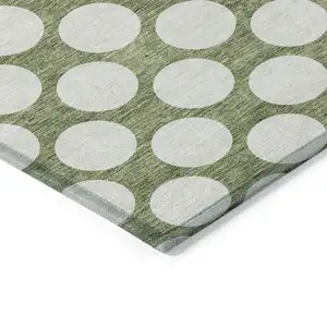 Photo of Green And Ivory Polka Dot Washable Indoor Outdoor Area Rug