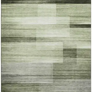 Photo of Green And Ivory Striped Washable Area Rug With UV Protection