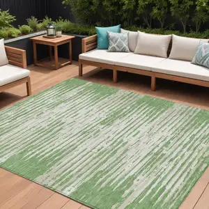 Photo of Green And Ivory Striped Washable Indoor Outdoor Area Rug
