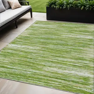 Photo of Green And Ivory Striped Washable Indoor Outdoor Area Rug