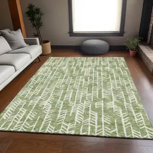 Photo of Green And Ivory Tribal Washable Area Rug With UV Protection