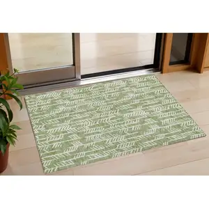Photo of Green And Ivory Tribal Washable Indoor Outdoor Area Rug