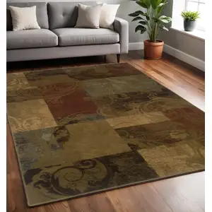 Photo of Green And Red Geometric Power Loom Stain Resistant Area Rug