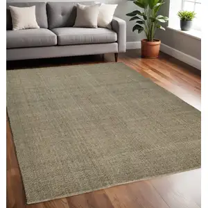 Photo of Green And Tan Hand Woven Area Rug