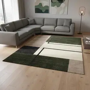 Photo of Green Black And Ivory Geometric Area Rug