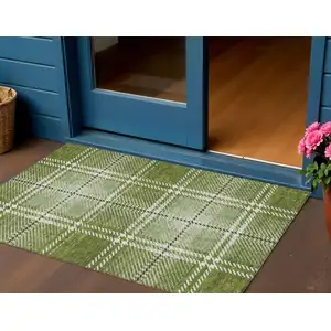 Photo of Green Black And Ivory Plaid Washable Indoor Outdoor Area Rug