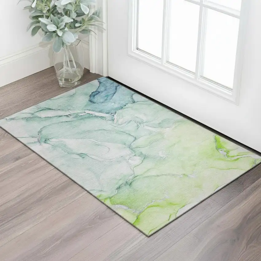 Green Blue And Ivory Abstract Washable Area Rug With UV Protection Photo 1