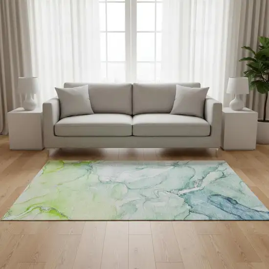 Green Blue And Ivory Abstract Washable Area Rug With UV Protection Photo 1