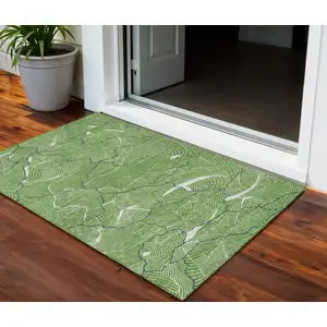 Photo of Green Blue And Ivory Abstract Washable Indoor Outdoor Area Rug