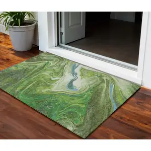 Photo of Green Blue And Ivory Abstract Washable Indoor Outdoor Area Rug