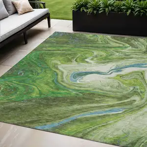 Photo of Green Blue And Ivory Abstract Washable Indoor Outdoor Area Rug