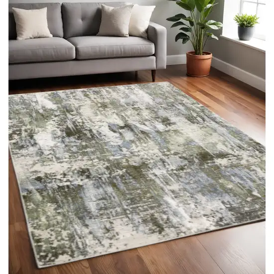 Green Blue Grey Ivory And Brown Abstract Power Loom Stain Resistant Area Rug Photo 1