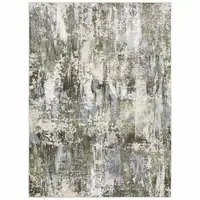 Photo of Green Blue Grey Ivory And Brown Abstract Power Loom Stain Resistant Area Rug