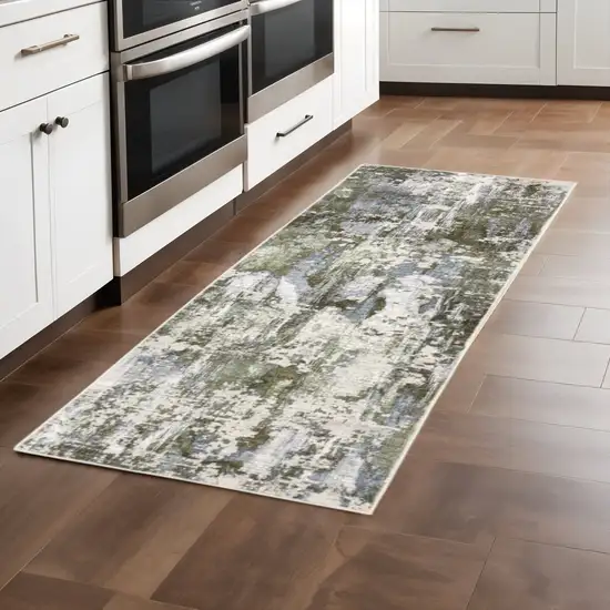 2' X 8' Green Blue Grey Ivory And Brown Abstract Power Loom Stain Resistant Runner Rug Photo 1