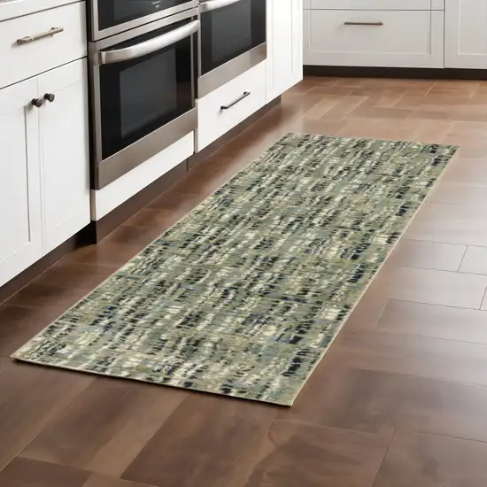 2' X 8' Green Blue Ivory Beige And Light Blue Abstract Power Loom Stain Resistant Runner Rug Photo 1