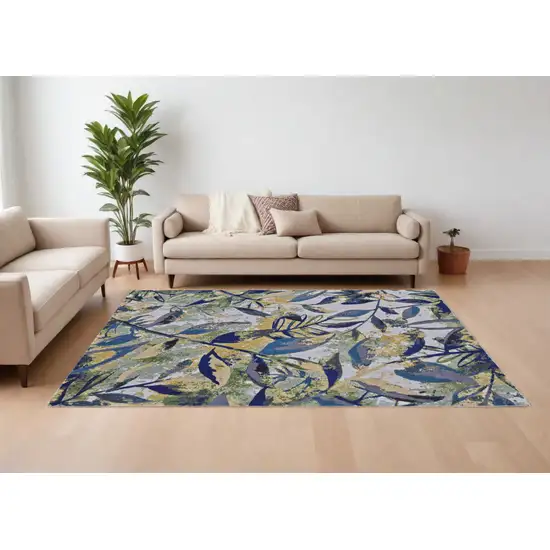 Green Blue and Ivory Floral Power Loom Worn Faded Area Rug Photo 1