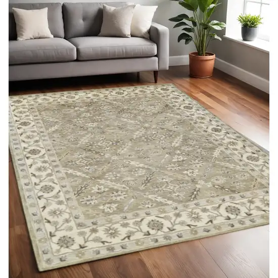 Green Brown And Taupe Wool Paisley Tufted Handmade Stain Resistant Area Rug Photo 1