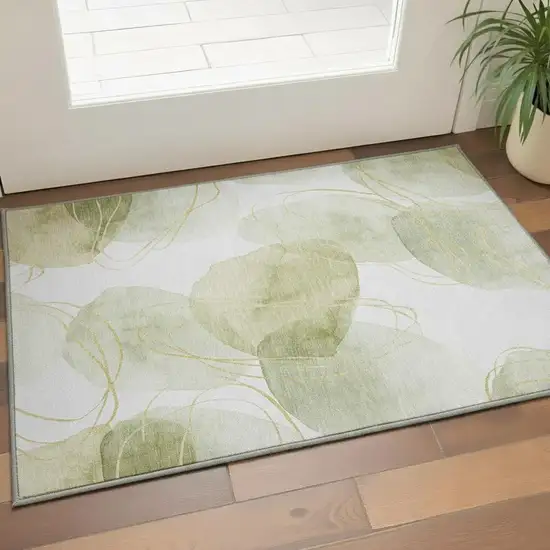 Green Gold And Ivory Abstract Washable Area Rug With UV Protection Photo 2