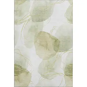 Photo of Green Gold And Ivory Abstract Washable Area Rug With UV Protection