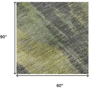 Photo of Green Gray And Gold Abstract Washable Area Rug With UV Protection