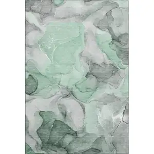 Photo of Green Gray And Ivory Abstract Washable Area Rug With UV Protection