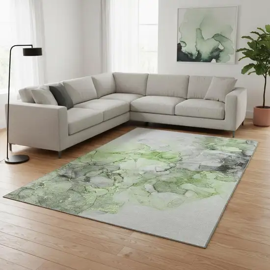 Green Gray And Ivory Abstract Washable Area Rug With UV Protection Photo 1