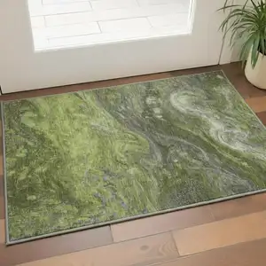Photo of Green Gray And Ivory Abstract Washable Area Rug With UV Protection