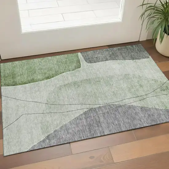 Green Gray And Ivory Abstract Washable Area Rug With UV Protection Photo 1