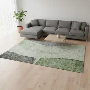 Photo of Green Gray And Ivory Abstract Washable Area Rug With UV Protection