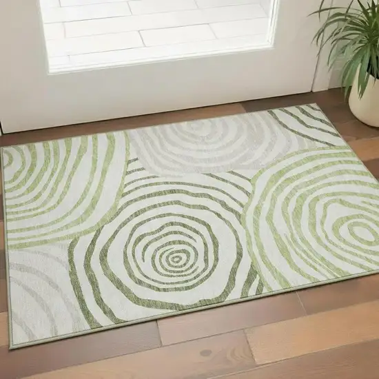 Green Gray And Ivory Abstract Washable Area Rug With UV Protection Photo 1